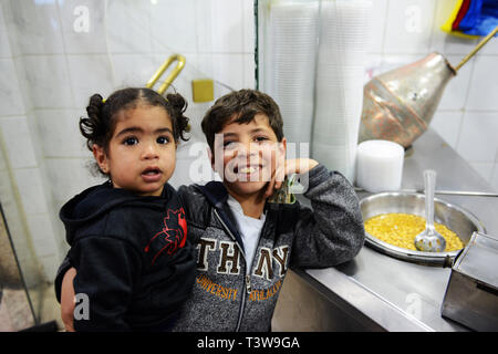 Jordanian children in a small Foul and Hummus restaurant in Madaba, Jordan. Stock Photo