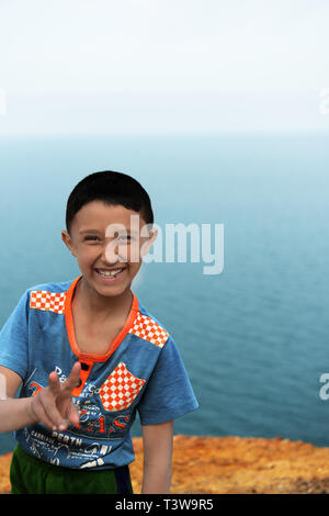 Smiling Jordanians posing for a snap by the Dead Sea. Stock Photo