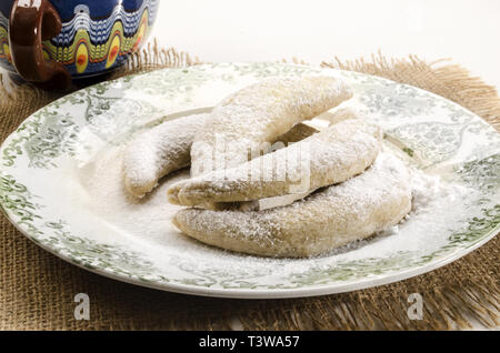 classic vanilla kipferl, traditional german cookies with powdered sugar on a plate Stock Photo