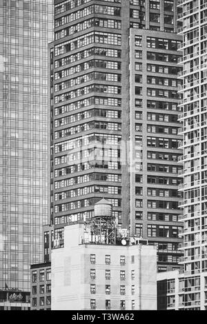 Black and white picture of a water tower on a rooftop, New York City, USA. Stock Photo