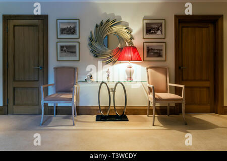 Table, chairs and lamp in foyer Stock Photo