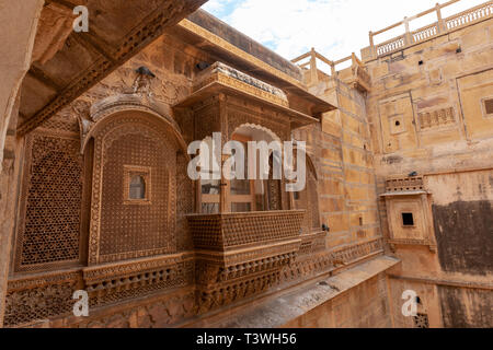 Jharokha (or jharoka) is a type of overhanging enclosed balcony in Patwon ki Haveli , Jaisalmer, Rajasthan, India Stock Photo