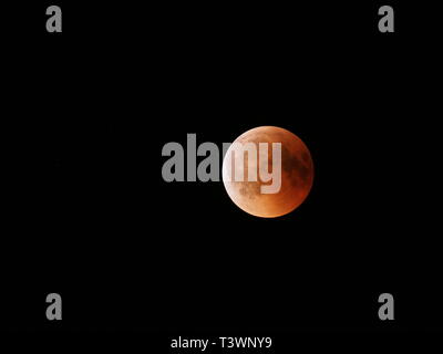 Great Blood Moon during longest total Lunar Eclipse of XXI century on black sky from Poland in 2018 Friday July 27 Stock Photo