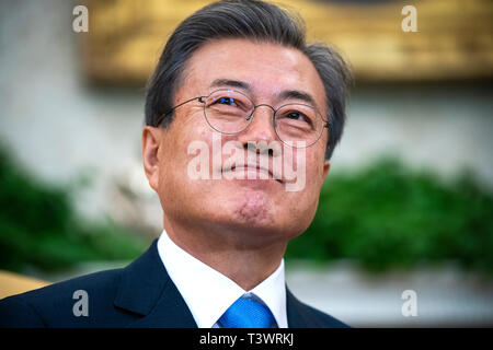 Washington, DC, USA. 11th Apr, 2019. Korean President Moon Jae-in listens to US President Donald J. Trump (not pictured) speak in the Oval Office of the White House in Washington, DC, USA, 11 April 2019. President Moon is expected to ask President Trump to reduce sanctions on North Korea in an attempt to jump start nuclear negotiations between North Korea and the US. Credit: Jim LoScalzo/Pool via CNP | usage worldwide Credit: dpa/Alamy Live News Stock Photo