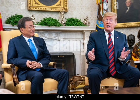Washington, DC, USA. 11th Apr 2019. US President Donald J. Trump (R) welcomes Korean President Moon Jae-in (L) to the Oval Office of the White House in Washington, DC, USA, 11 April 2019. President Moon is expected to ask President Trump to reduce sanctions on North Korea in an attempt to jump start nuclear negotiations between North Korea and the US. Credit: Jim LoScalzo/Pool via CNP /MediaPunch Credit: MediaPunch Inc/Alamy Live News Stock Photo