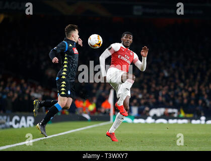 London, UK. 11th Apr, 2019. Napoli's Mario Rui (L) competes for the ball with Arsenal's Ainsley Maitland-Niles during the UEFA Europa League Quarter Final First Leg match between Arsenal and Napoli at The Emirates Stadium in London, Britain on April 11, 2019. Arsenal won 2-0. Credit: Matthew Impey/Xinhua/Alamy Live News Stock Photo