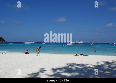 Similan, Thailand. 08th Mar, 2019. Tourists walk on the beach of the 'Ao Kuerk' bay of the island Ko Similan. Ko Similan is the name-giving island of a total of nine islands in the Andaman Sea. The uninhabited islands together with two other islands form the Mu Ko Similan National Park. Credit: Alexandra Schuler/dpa/Alamy Live News Stock Photo