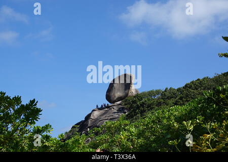 Similan, Thailand. 08th Mar, 2019. Tourists climb the rock formation 'the sail' at the 'Ao Kuerk' bay of the island Ko Similan. Ko Similan is the name-giving island of a total of nine islands in the Andaman Sea. The uninhabited islands together with two other islands form the Mu Ko Similan National Park. Credit: Alexandra Schuler/dpa/Alamy Live News Stock Photo