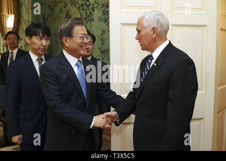 April 11, 2019 - Seoul, SOUTH KOREA - April 12, 2019-Seoul, South Korea-I this pictures taken photographer is South Korean President House Officials. South Korean President Moon Jae In and US Vice President Mike Pence shake hands at White House in Washington, USA. President Donald Trump's meeting with South Korean President Moon Jae-in comes amid uncertainty over whether the leader of North Korea is considering backing out of nuclear negotiations or restarting nuclear and missile tests. (Credit Image: © Zuma Press via ZUMA Wire) Stock Photo