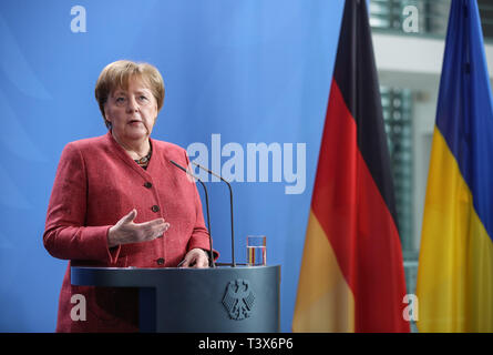 Berlin, Germany. 12th Apr, 2019. German Chancellor Angela Merkel attends a joint press conference with visiting Ukrainian President Petro Poroshenko (not in the picture) at the German Chancellery in Berlin, capital of Germany, on April 12, 2019. Credit: Shan Yuqi/Xinhua/Alamy Live News Stock Photo
