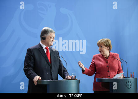 Berlin, Germany. 12th Apr, 2019. German Chancellor Angela Merkel (R) and visiting Ukrainian President Petro Poroshenko attend a joint press conference at the German Chancellery in Berlin, capital of Germany, on April 12, 2019. Credit: Shan Yuqi/Xinhua/Alamy Live News Stock Photo