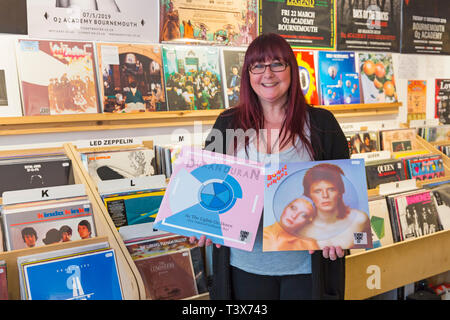 Bournemouth, Dorset, UK. 12th Apr 2019. The Vault record shop at Commercial Road, Bournemouth prepare for Record Store Day tomorrow, encouraging people to visit and support local record stores. The store opens at 8am with queues expected to access hundreds of limited editions from a wide range of artists, which they cannot save beforehand or preorder. The Legends like David Bowie and Queen who are no longer with us will be popular vinyls.  Chrissy holds up Bowie PinUps and Duran Duran As the Lights Go Down. Credit: Carolyn Jenkins/Alamy Live News Stock Photo