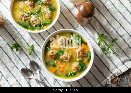 Homemade Italian Wedding Soup with Spinach and Meatballs Stock Photo
