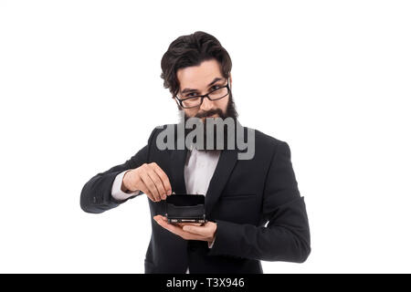 bearded businessman holding an open mini briefcase, isolated on white background, small business concept Stock Photo