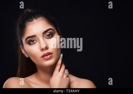 Classic close up vogue beauty portrait with professional make up and hairstyle beautiful girl in studio lights. Stock Photo