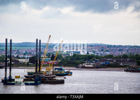 Gravesend, Kent, UK. A view from the river Thames looking over the industrial  area of East Gravesend. Boats and other marine shipping can be seen. Stock Photo