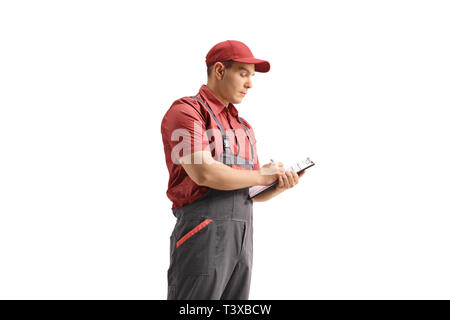Delivery guy writing in a clipboard isolated on white background Stock Photo
