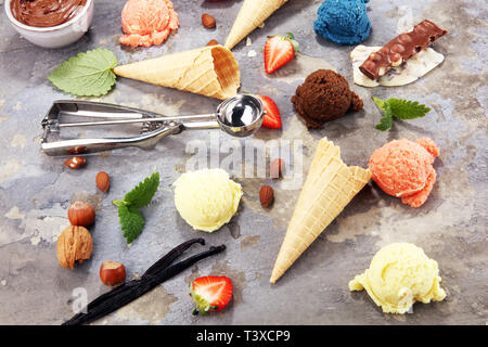Set of ice cream scoops of different colors and flavours with berries and fruits decoration. icecream variation Stock Photo