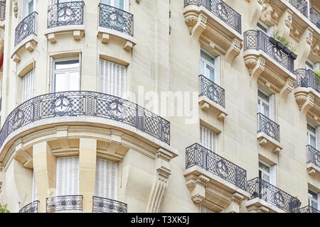 PARIS, FRANCE - JULY 23, 2017: Ancient luxury parisian building facade in summer day in Paris, France Stock Photo