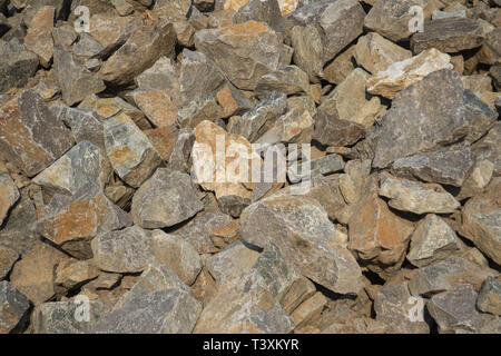 Textured background, stone red color, stacked on pile Stock Photo