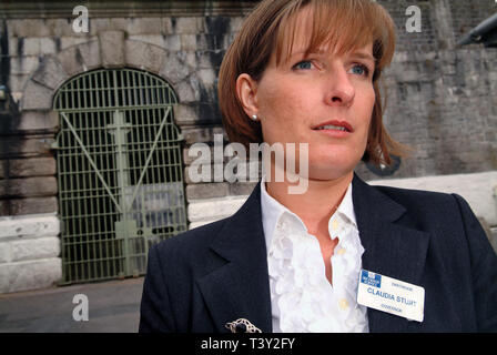 Claudia Sturt, former Governor of HM Prison Dartmoor, UK, outside the main entrance gate (bell over) inside and behind the main gate (barrred) Stock Photo