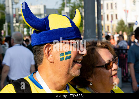Smiling Swedish male fan in blue and yellow viking horn helmet and sunglasses - FIFA World Cup Russia 2018 Mexico v Sweden, Ekaterinburg Stock Photo