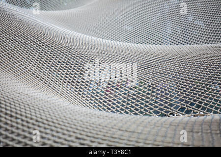 A scale of 250m bouncing net, its highest point will be suspended above ground, will offer visitors a unique experience at Jewel Changi Airport. Stock Photo