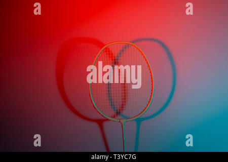 Close up badminton racket on red background Stock Photo