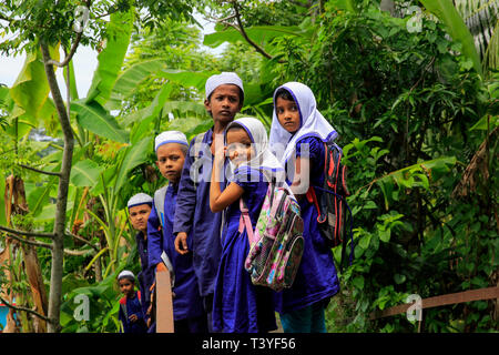 Rural boys on the way to madrasha at Najirpur in Pirojpur, Bangladesh. Stock Photo