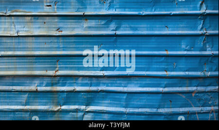 Old blue grungy corrugated metal wall, frontal background photo texture Stock Photo