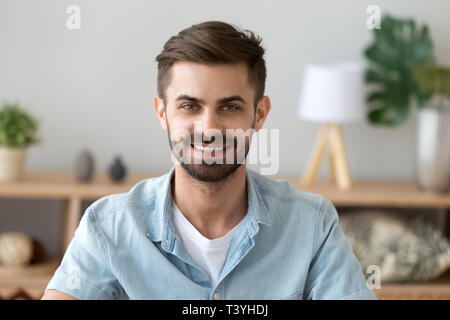 Head shot portrait of smiling satisfied man looking at camera Stock Photo