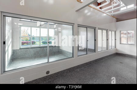 Glass windows to holding areas in animal shelter Stock Photo