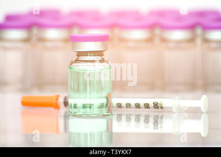 New drug discovery concept in new vaccine discovery. Sterile injection products manufacturing background. Stock Photo