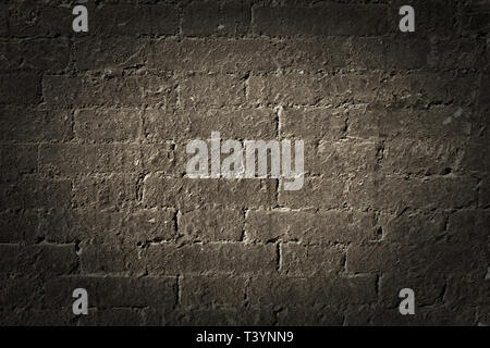 Old brick wall grunge background texture black vignette Stock Photo