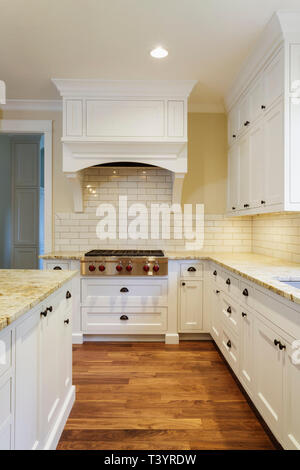 Interior of kitchen with white counters, shelf units and utensils Stock ...