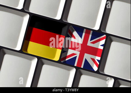 Translate into English or German - Keyboard with flags of Germany and United Kingdom - Red and Green Stock Photo