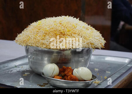 Hyderabadi biryani with eggs and red chicken Stock Photo