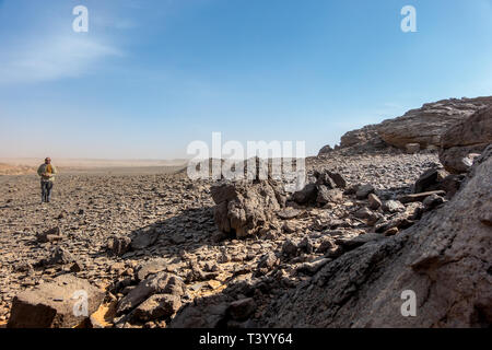 Meroe, Sudan, February 10., 2019: View of the stone desert near Meroe, Sudan, with black and grey stones and pebbles Stock Photo