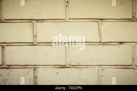 Panoramic canvas of old uneven block shape white color wide brick wall background of a vintage house facade. Modern style design decorative ideas. Clo Stock Photo