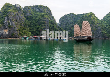 Traditional old junk boat near floating village in Ha Long Bay, Vietnam Stock Photo