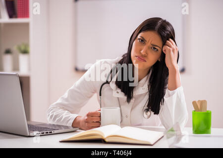 Young doctor is tired. Stock Photo