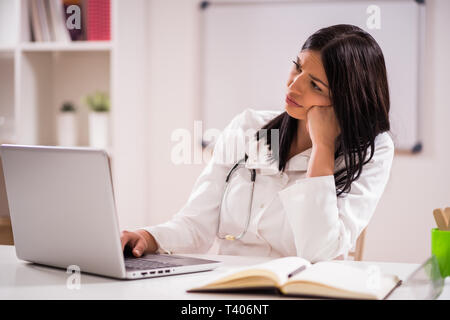 Young doctor is tired. Stock Photo