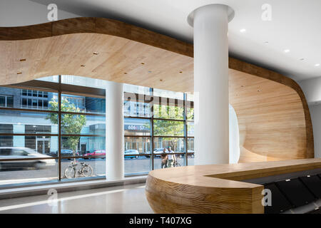Interior view of the extended canopy sweeping through the lobby, reception desk in the foreground. Helena 57 West, New York, United States. Architect: Stock Photo