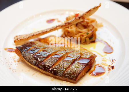 Seabass cooked in asian style with teriyaki sauce Stock Photo