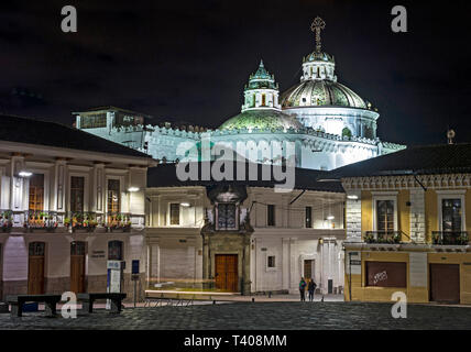 Historical old town of Quito by night, with the lit domes of the Jesuit church La Compañia de Jesús in the background, Ecuador Stock Photo