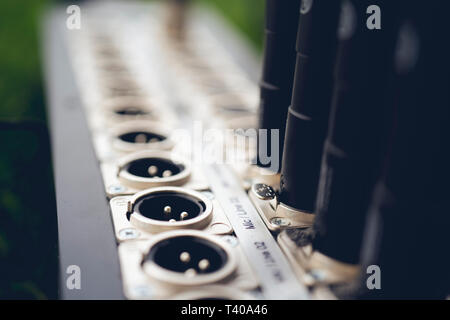 Series of connection xlr connector. Rear of sound control panel. Close up. Stock Photo