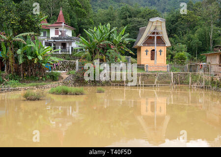 Tongkonan houses, traditional Torajan buildings, Tana Toraja is the traditional ancestral house of the Torajan people, in South Sulawesi,Indonesia. To Stock Photo