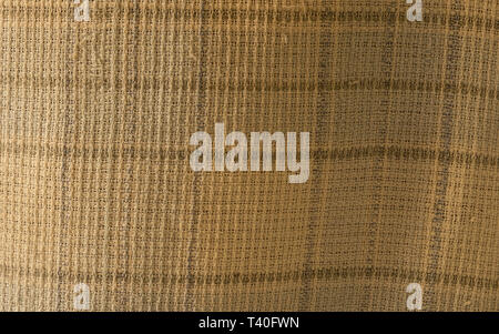 Close up of crumpled fabric texture, linen cloth textile background of light fabric with Crisscross wave. Natural canvas pattern background. Studio sh Stock Photo