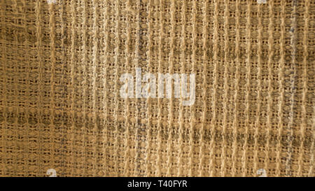 Close up of crumpled fabric texture, linen cloth textile background of light fabric with Crisscross wave. Natural canvas pattern background. Studio sh Stock Photo