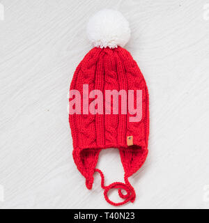 cute cozy knitted children winter red hat Stock Photo